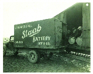Staab Battery employees unloading railcar of lead oxide drums